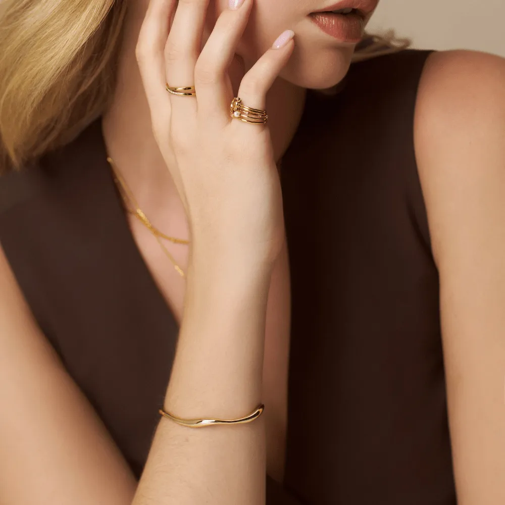 Orelia Fine Wave bangle armbånd guld bølge
