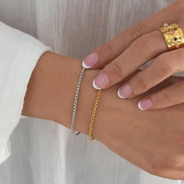 TIMI OF SWEDEN Nori Link armbånd stål guld 16+3 cm unisex