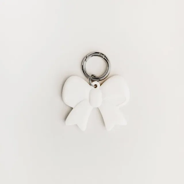 Orelia Cream Bow taskecharm creme sløjfe