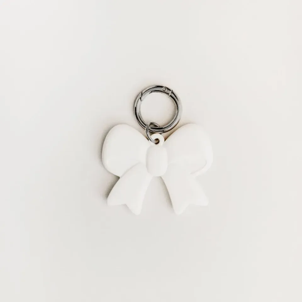 Orelia Cream Bow taskecharm creme sløjfe