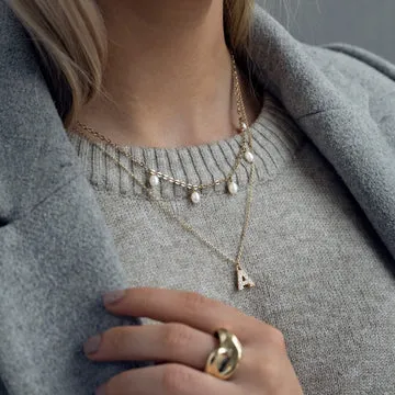 TIMI OF SWEDEN Juno crystal letter halskæde guld stål