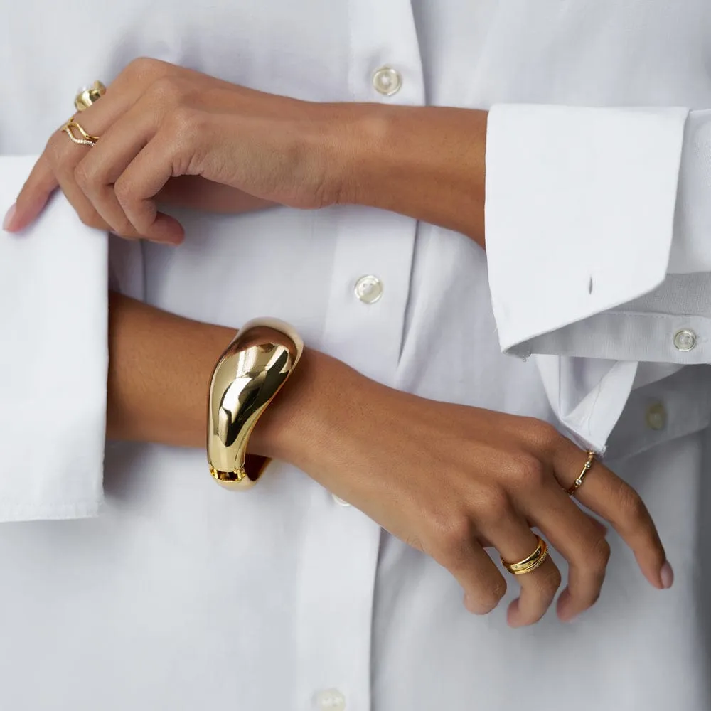 Orelia Statement Wave bangle forgyldt