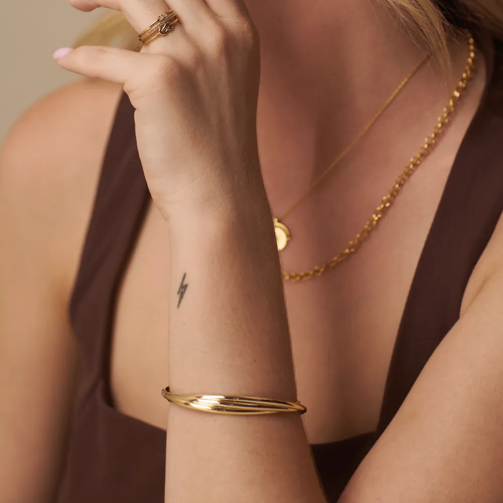 Orelia Interlocking Open Bangle forgyldt armbånd