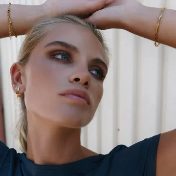 TIMI OF SWEDEN Winona øreringe stjerne guld messing