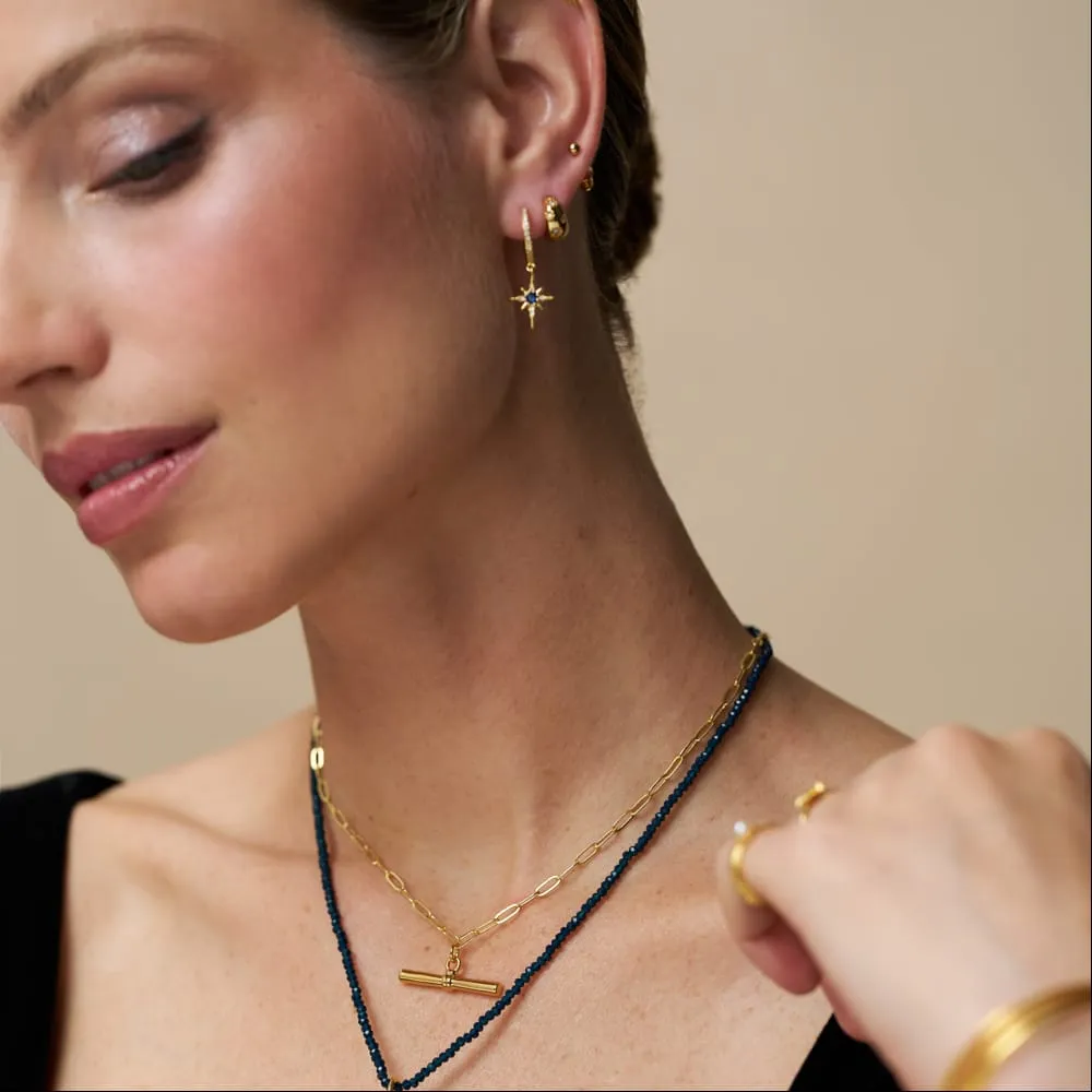 Orelia Blue Crystal Starburst huggie hoops guld blå