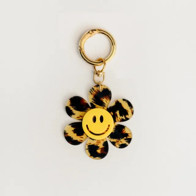 Orelia Animal Print Happy Face Flower taskevedhæng blomst
