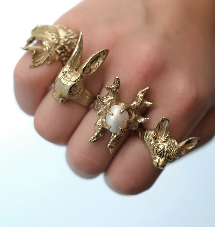 Wos Pearl-Claw Wings ring messing perle justerbar